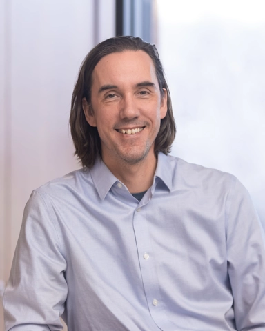 portrait of a smiling person in professional attire